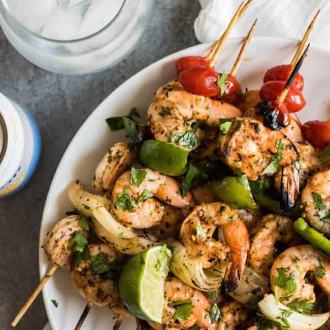 These quick, easy and healthy Grilled Garlic Herb Shrimp Skewers are perfect for summer grilling or roasting!