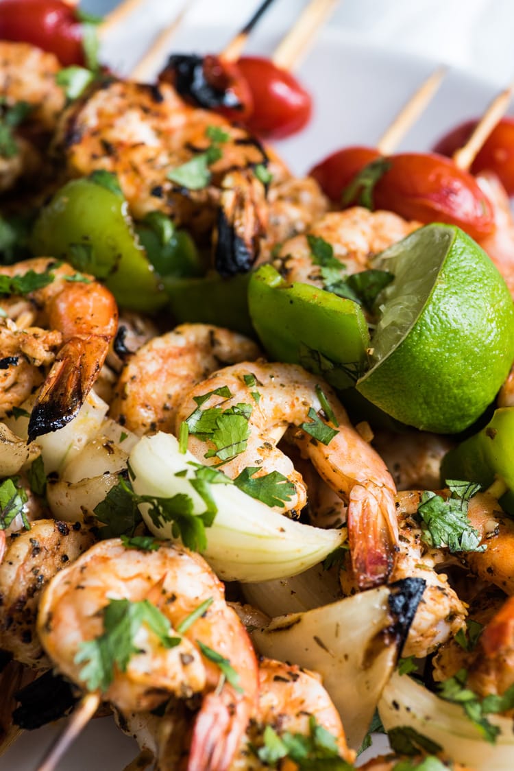 Grilled shrimp on wooden skewers.