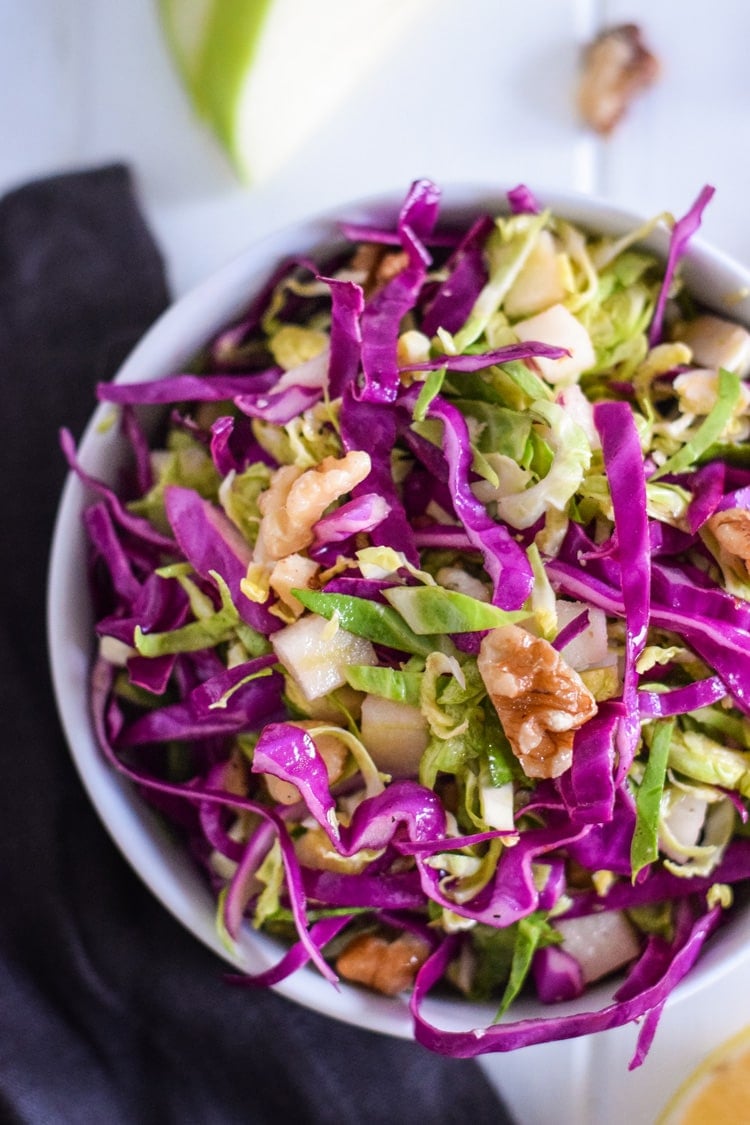 This healthy Brussels Sprouts Slaw with Cabbage and Apples is the perfect side dish for any meal. Also goes great on tacos! (gluten free, paleo, vegetarian, vegan)