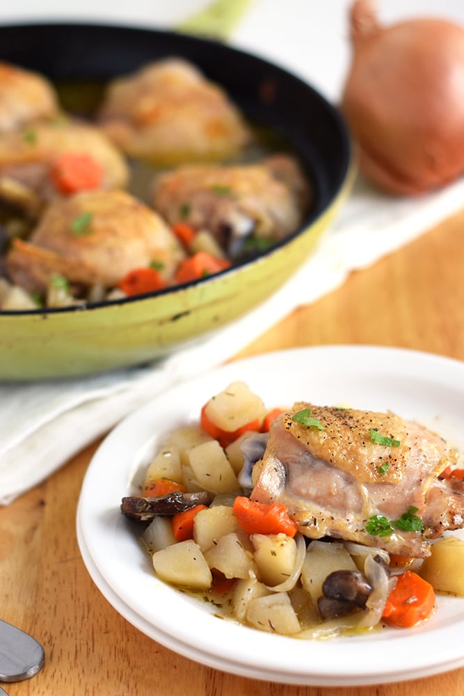 This Oven Roasted Chicken with Winter Vegetables recipe is the perfect one-skillet meal for those cold winter nights when all you want to do is snuggle up under a warm blanket on the couch. - isabeleats.com