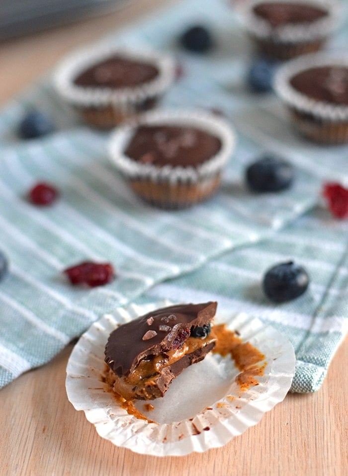 Chocolate Almond Butter Berry Cups topped with sea salt - no added sugar, no bake, dairy free, gluten free, paleo, raw, vegan, vegetarian // isabeleats.com