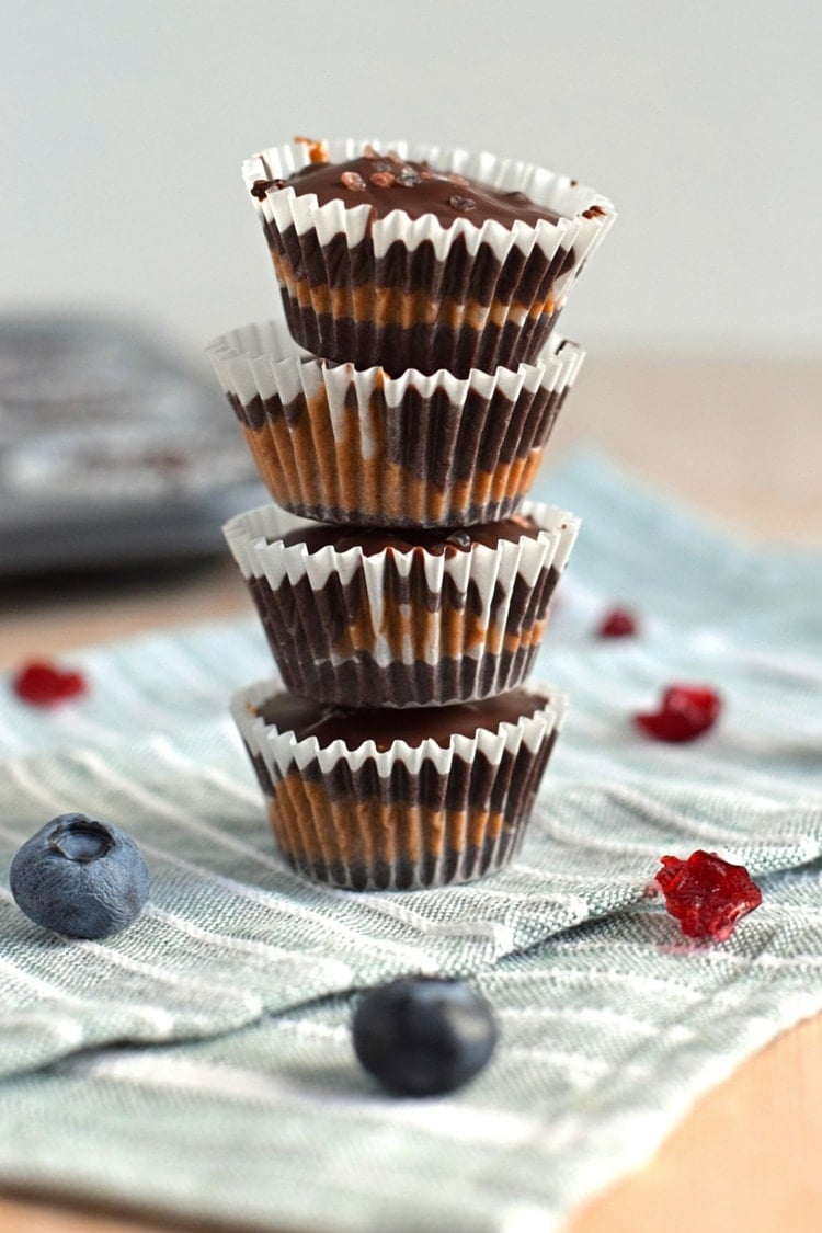 Chocolate Almond Butter Berry Cups topped with sea salt - no added sugar, no bake, dairy free, gluten free, paleo, raw, vegan, vegetarian // isabeleats.com