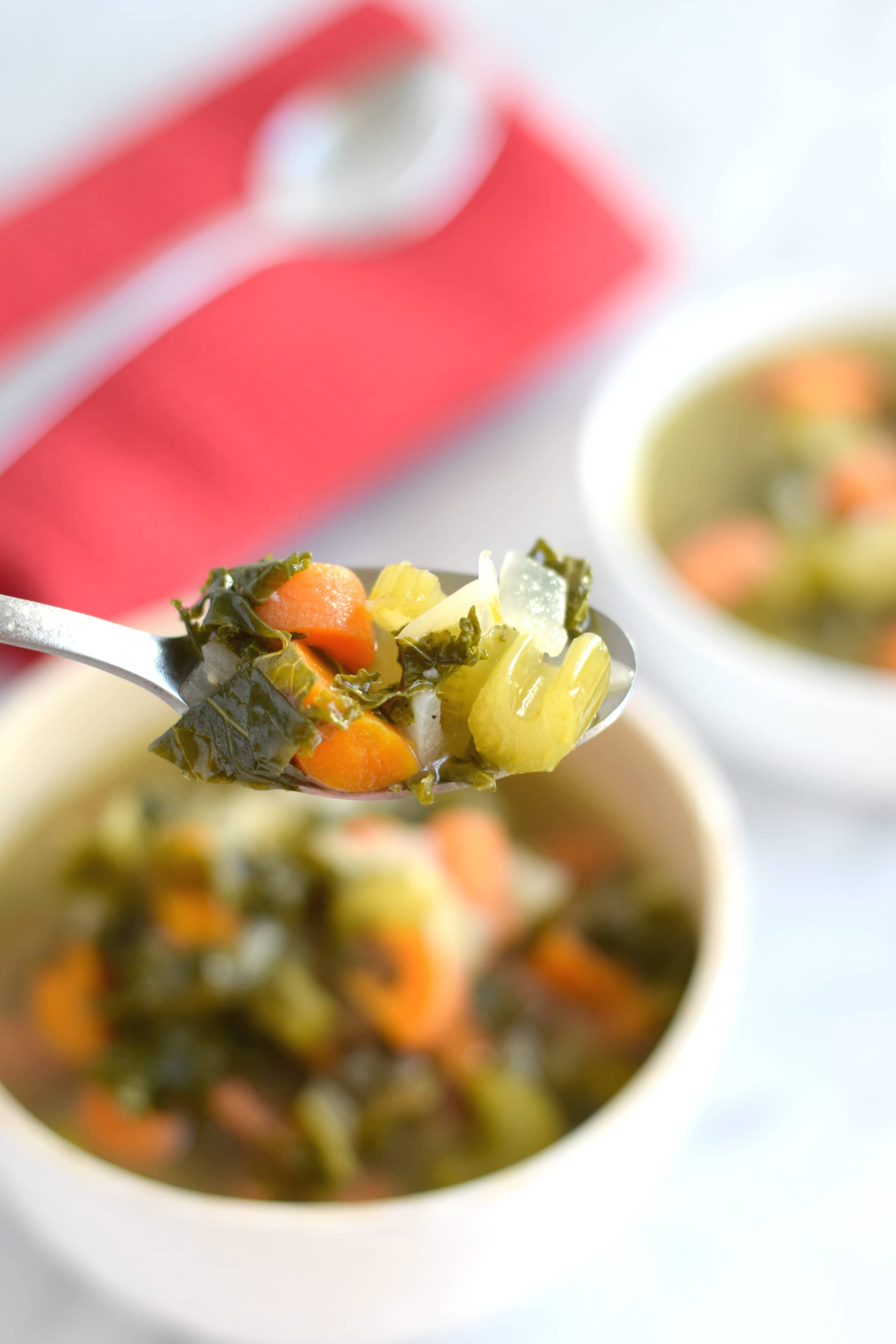 This Winter Kale Vegetable soup is loaded with vegetables like kale, carrots and celery and packed with super savory herbs like rosemary, thyme and garlic. Perfect for the cold winter days. (gluten free, paleo, vegetarian, vegan) - isabeleats.com