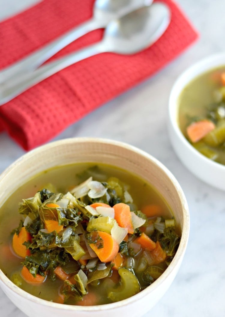 This Winter Kale Vegetable soup is loaded with vegetables like kale, carrots and celery and packed with super savory herbs like rosemary, thyme and garlic. Perfect for the cold winter days. (gluten free, paleo, vegetarian, vegan) - isabeleats.com