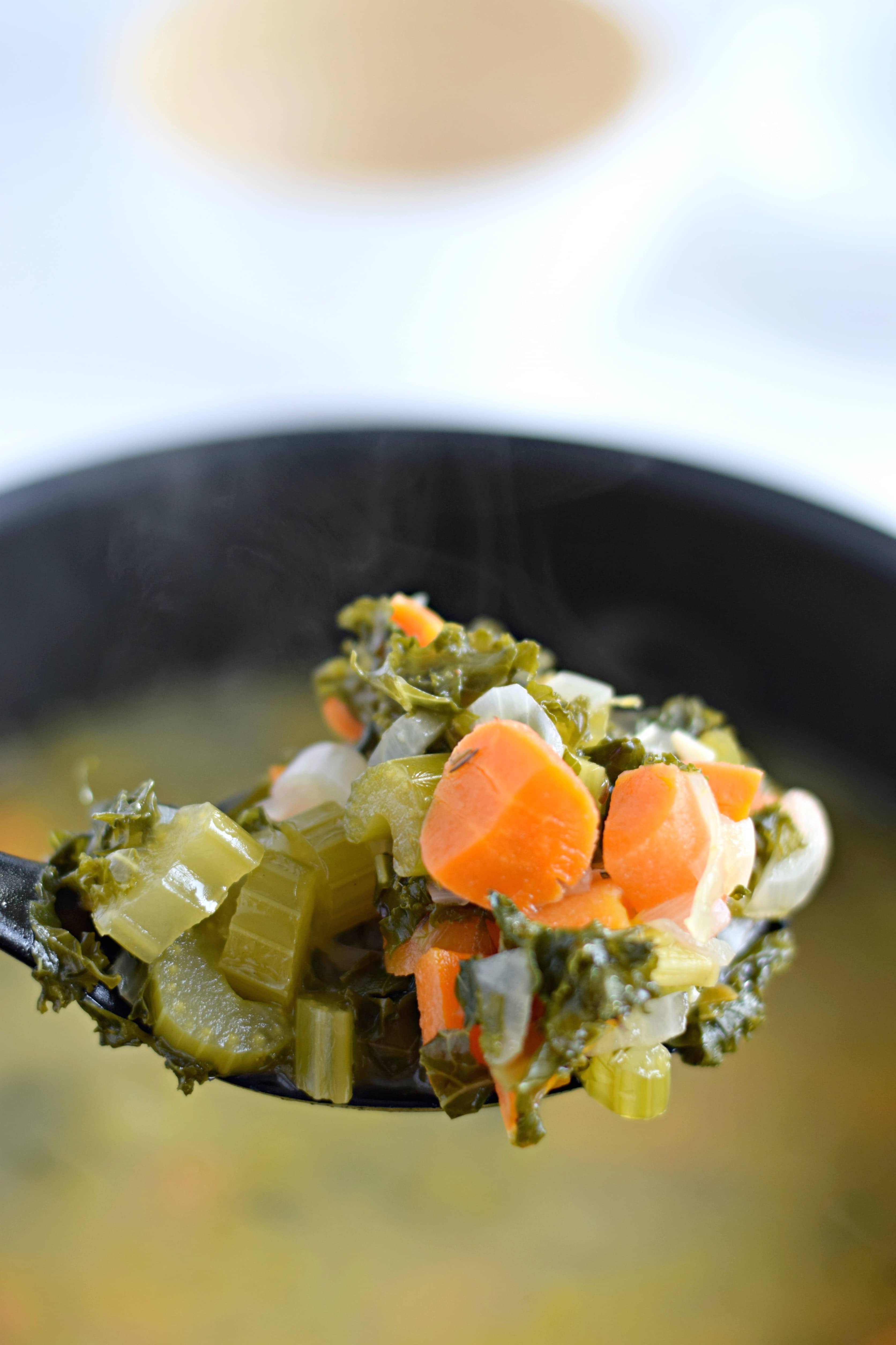 This Winter Kale Vegetable soup is loaded with vegetables like kale, carrots and celery and packed with super savory herbs like rosemary, thyme and garlic. Perfect for the cold winter days. (gluten free, paleo, vegetarian, vegan) - isabeleats.com