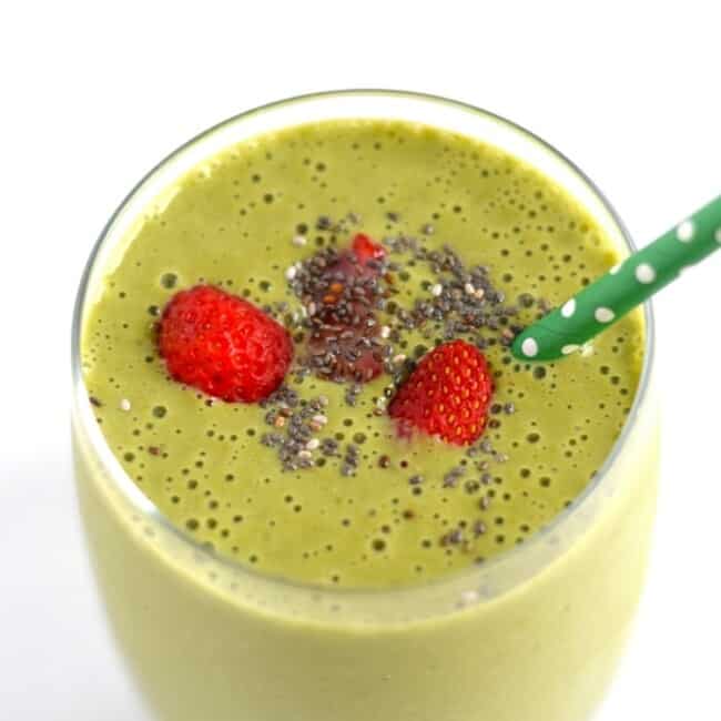 Strawberry Mango Green Smoothie - An easy, quick and tasty on-the-go breakfast smoothie or post-workout drink filled with fruit, greens and greek yogurt. Can easily be dairy free! - fromcatstocooking.com
