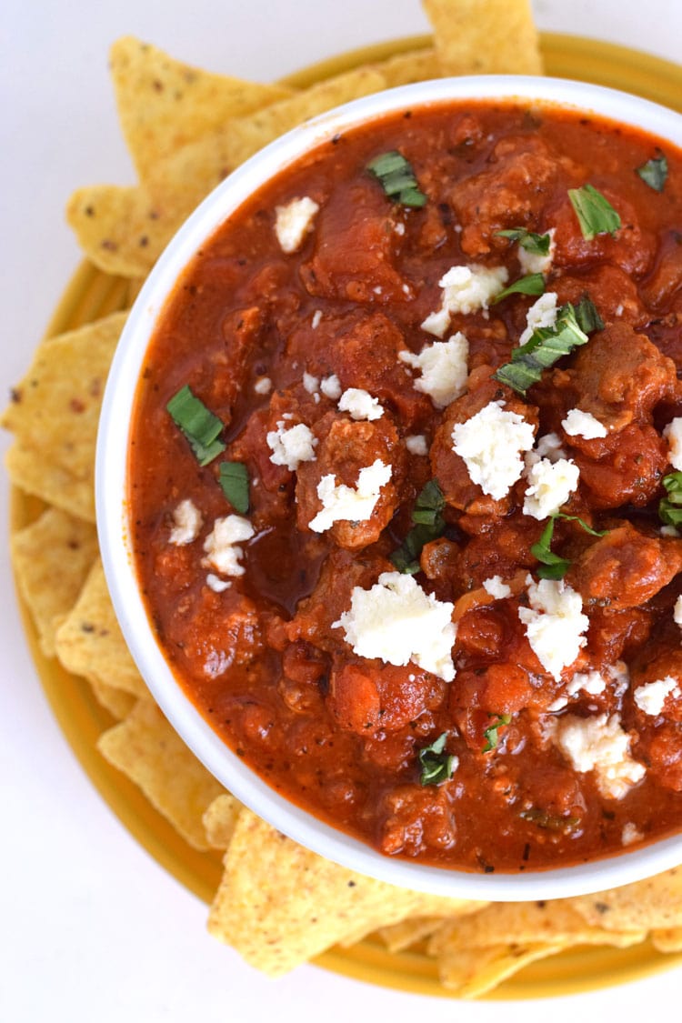 Cheesy Spicy Sausage Dip - A spicy, cheesy, tomato-based dip that's delicious with tortilla chips or pita bread. Is gluten free, grain free, paleo and can easily be made dairy free by simply omitting the cheese. Perfect as an appetizer when you're entertaining or just feel like eating some dip :) // isabeleats.com