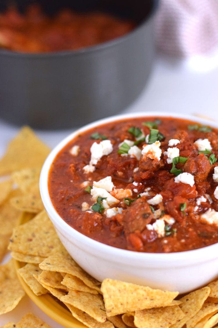 Cheesy Spicy Sausage Dip - A spicy, cheesy, tomato-based dip that's delicious with tortilla chips or pita bread. Is gluten free, grain free, paleo and can easily be made dairy free by simply omitting the cheese. Perfect as an appetizer when you're entertaining or just feel like eating some dip :) // isabeleats.com