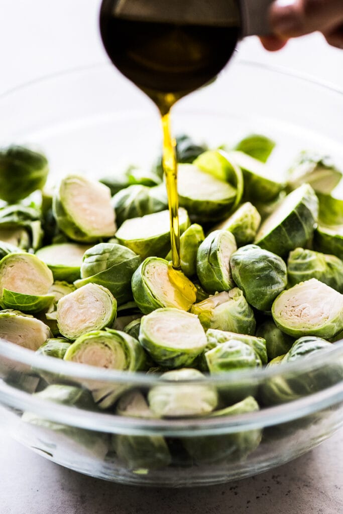 a honey garlic sauce being poured in a bowl