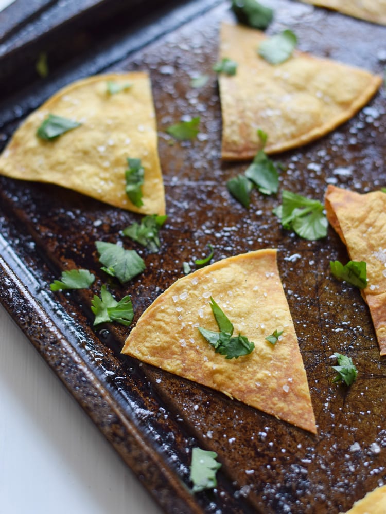 These Homemade Lime Tortilla Chips are crunchy, salty, easy to make and are baked with a hint of lime for a nice little zesty kick. They've taken my chips and salsa game to a whole new level! Perfect on their own as a snack or with some guac or salsa as an appetizer.