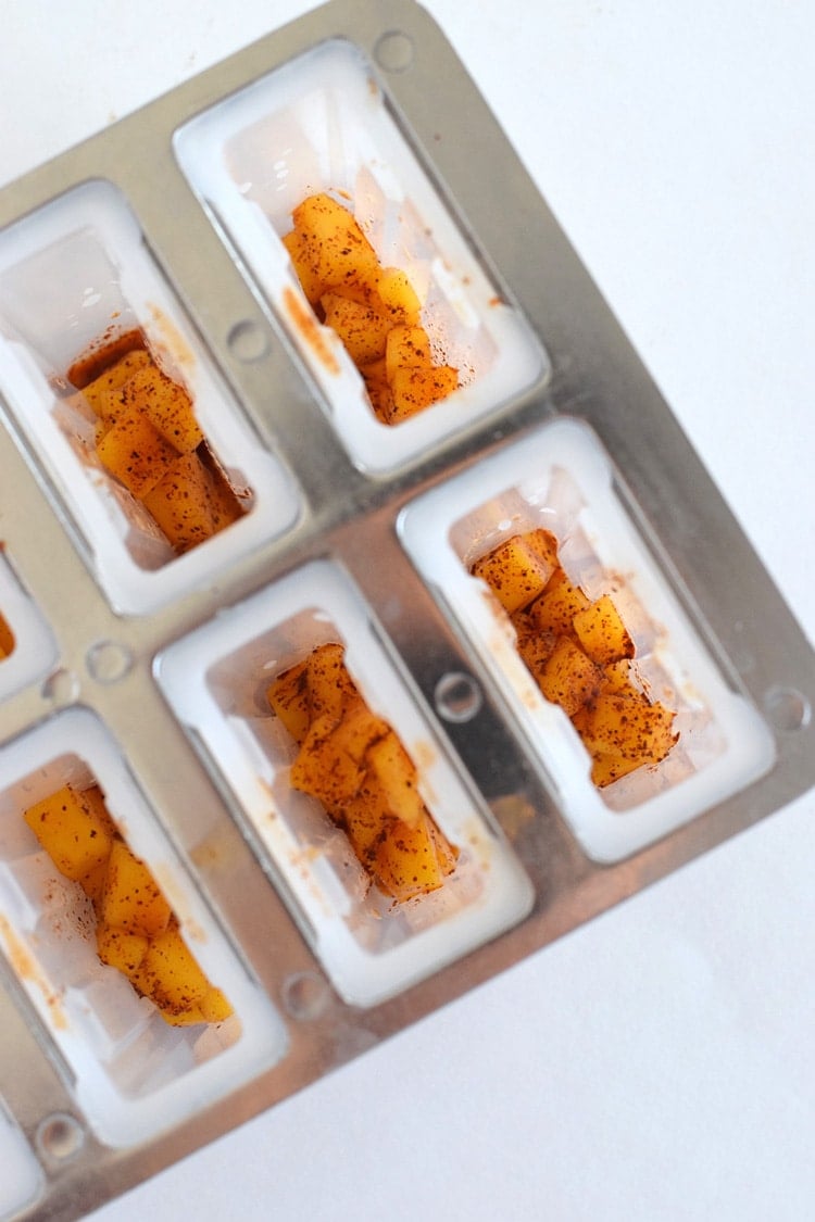 This easy to make Mexican-inspired Mango Chili Popsicle recipe is made with only 4 ingredients and makes a perfect healthy afternoon snack or dessert for those hot summer days.