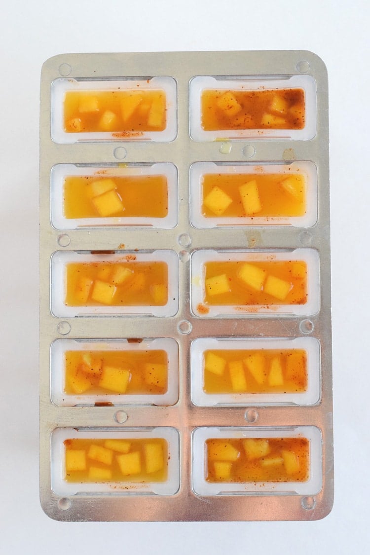 This easy to make Mexican-inspired Mango Chili Popsicle recipe is made with only 4 ingredients and makes a perfect healthy afternoon snack or dessert for those hot summer days.