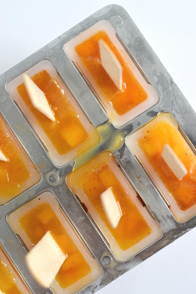 This easy to make Mexican-inspired Mango Chili Popsicle recipe is made with only 4 ingredients and makes a perfect healthy afternoon snack or dessert for those hot summer days.