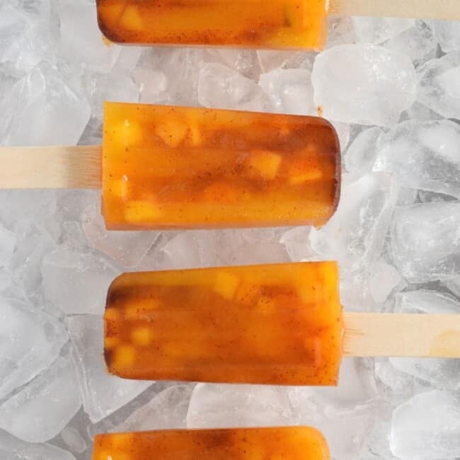 This easy to make Mexican-inspired Mango Chili Popsicle recipe is made with only 4 ingredients and makes a perfect healthy afternoon snack or dessert for those hot summer days.
