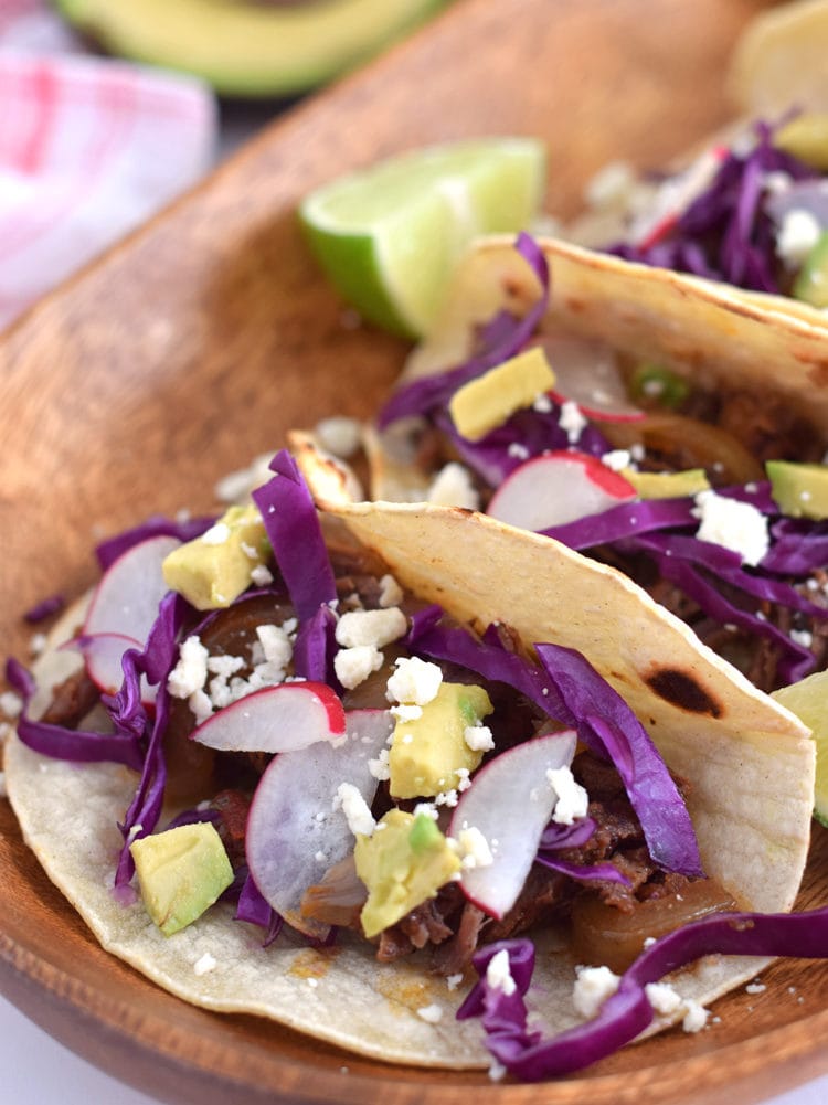 These Mexican Slow Cooker Chipotle Beef Tinga Tacos are easy to make and are simmered in a slow cooker with chipotle chiles and fire roasted tomatoes. Perfect for an easy, weeknight meal! 