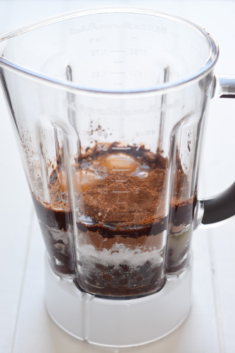 A blender full of ingredients for black bean brownies