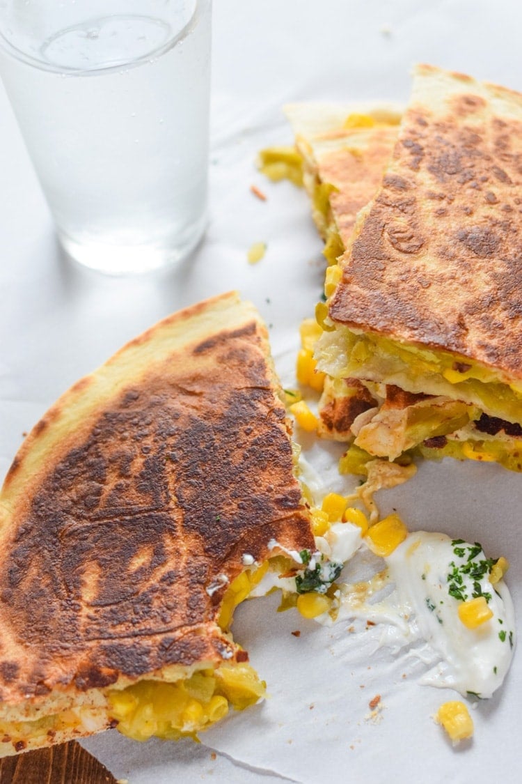 These Easy Green Chile & Corn Quesadillas take only 12 minutes to make, are an easy lunch or dinner option and are vegetarian friendly! Plus, they're also an inexpensive meal. All you need are some flour tortillas, canned corn, canned diced green chiles and shredded cheese!