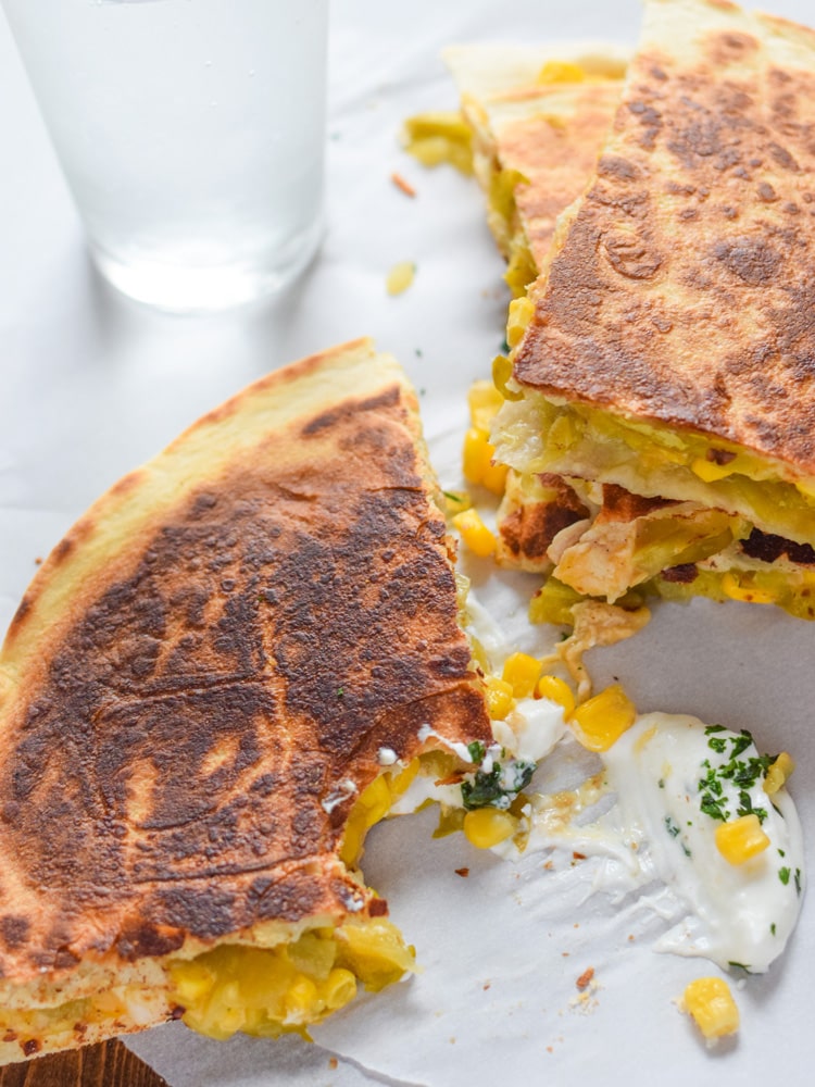 These Easy Green Chile Corn Quesadillas take only 12 minutes to make, are an easy lunch or dinner option and are vegetarian friendly! Plus, they're also an inexpensive meal. All you need are some flour tortillas, canned corn, canned diced green chiles and shredded cheese!