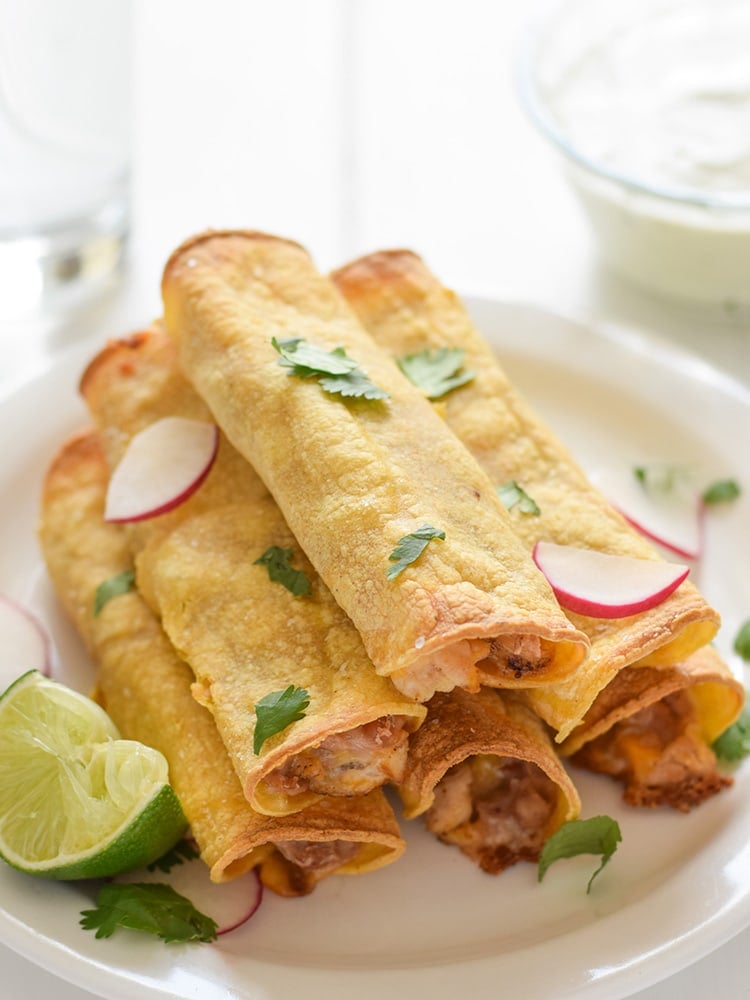 If you're looking for an easy, freezer-friendly meal, look no further than these Baked Chicken, Bean & Cheese Taquitos. Loaded with mashed pinto beans, shredded Mexican cheese and chili-spiced baked chicken, these taquitos are just like your favorite tacos, but even more fun to eat!