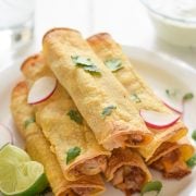 If you're looking for an easy, freezer-friendly meal, look no further than these Baked Chicken, Bean & Cheese Taquitos. Loaded with mashed pinto beans, shredded Mexican cheese and chili-spiced baked chicken, these taquitos are just like your favorite tacos, but even more fun to eat!