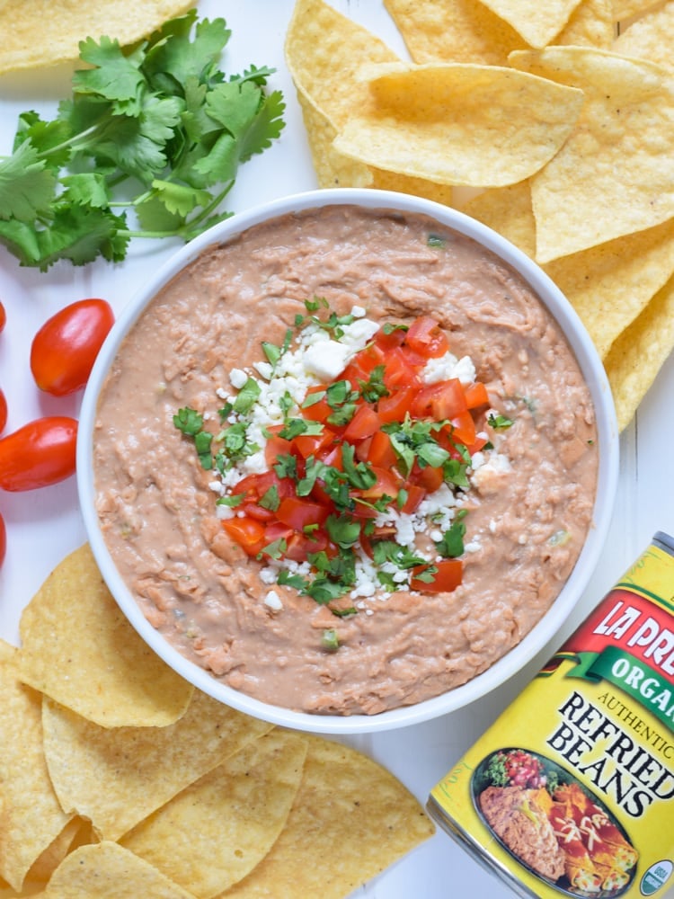 This creamy bean dip recipe is made with cream cheese, Mexican spices and diced jalapenos. It's easy to make and is the perfect appetizer or snack!