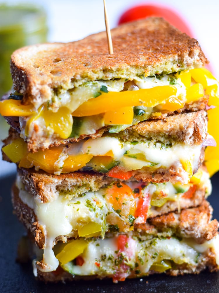 Made with sautéed vegetables, a cilantro parsley chimichurri spread and lots of melted cheese, this Mexican Fajita Grilled Cheese will leave you full and oh so happy. (vegetarian)