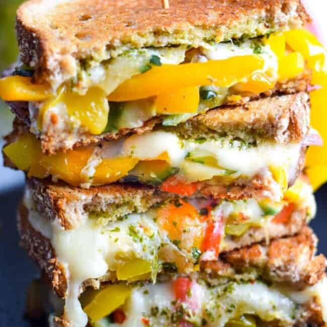 Made with sautéed vegetables, a cilantro parsley chimichurri spread and lots of melted cheese, this Mexican Fajita Grilled Cheese will leave you full and oh so happy. (vegetarian)
