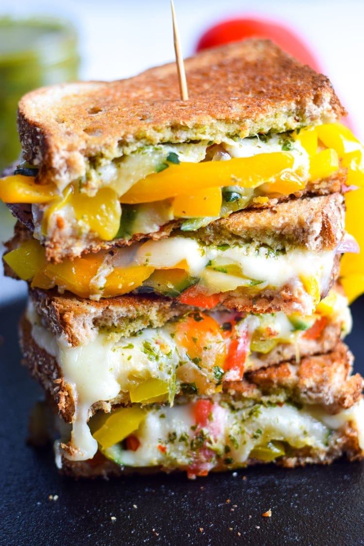 Made with sautéed vegetables, a cilantro parsley chimichurri spread and lots of melted cheese, this Mexican Fajita Grilled Cheese will leave you full and oh so happy. (vegetarian)