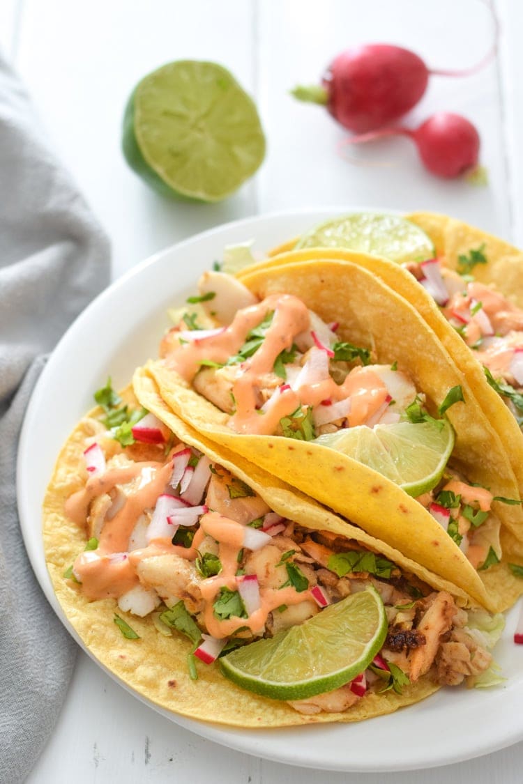 Made with a bright and creamy chipotle lime crema made with greek yogurt and lime juice, these Fish Tacos take only 15 minutes to make and are gluten free!