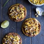 Ready in only 15 minutes, these Mexican Street Corn Tostadas made with canned corn, cotija cheese and chopped cilantro make for an easy lunch or quick dinner that's also gluten free and vegetarian.