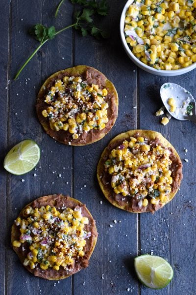 Ready in only 15 minutes, these Mexican Street Corn Tostadas made with canned corn, cotija cheese and chopped cilantro make for an easy lunch or quick dinner that's also gluten free and vegetarian.