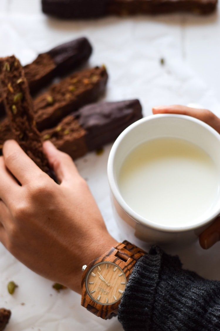 Homemade Mexican Chocolate Pumpkin Seed Biscotti dipped in melted chocolate and sprinkled with sea salt. Holiday perfection. Also features JORD Wood Watch Fieldcrest Zebrawood and Maple.