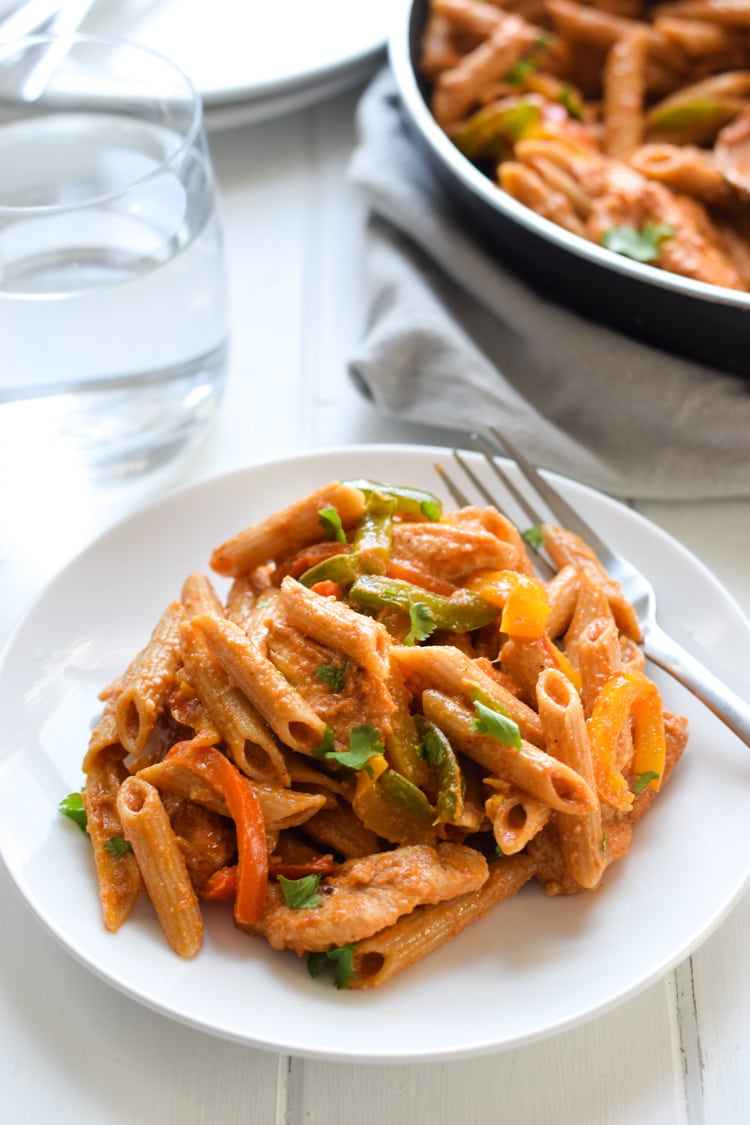 Filled with colorful bell peppers in a light yet creamy chili tomato sauce, this Healthy Chicken Fajita Pasta is perfect for those busy nights when you need to get something delicious yet healthy on the table quickly.