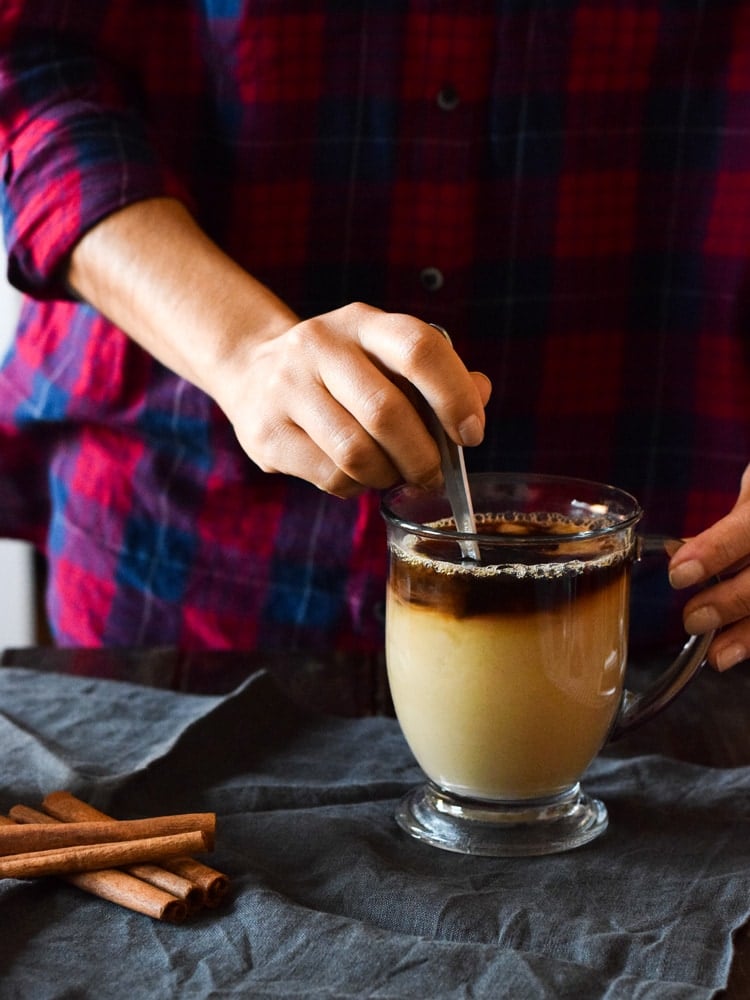 This Mexican Tres Leches Coffee topped with a mountain of whipped cream, cinnamon and chocolate shavings is easy to make at home and irresistibly yummy! Perfect for the holidays and the cold winter nights!