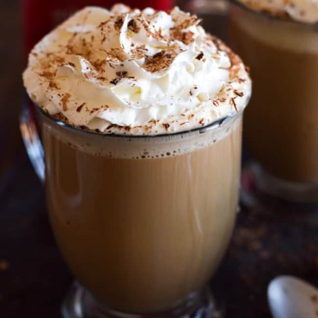 This Mexican Tres Leches Coffee topped with a mountain of whipped cream, cinnamon and chocolate shavings is easy to make at home and irresistibly yummy! Perfect for the holidays and the cold winter nights!