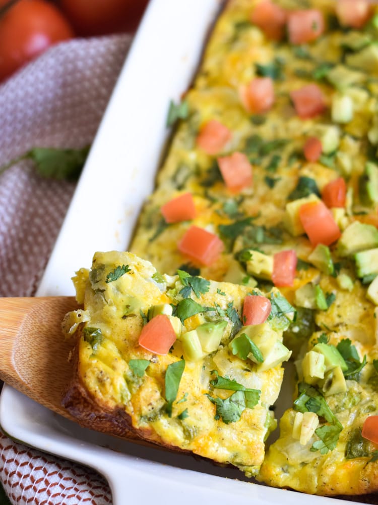 This Salsa Verde Breakfast Frittata is what breakfast dreams are made of. Topped with a salsa verde yogurt sauce, this vegetarian dish is perfect for brunch on those lazy weekends. Is gluten free, vegetarian, paleo and low carb.