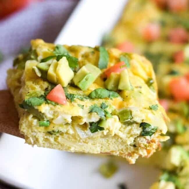 This Salsa Verde Breakfast Frittata is what breakfast dreams are made of. Topped with a salsa verde yogurt sauce, this vegetarian dish is perfect for brunch on those lazy weekends. Is gluten free, vegetarian, paleo and low carb.