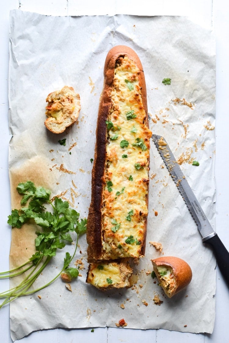 A crowd favorite, this Chicken Fajita Stuffed French Bread is a creamy, cheesy, and super flavorful appetizer that's perfect for parties and game day!