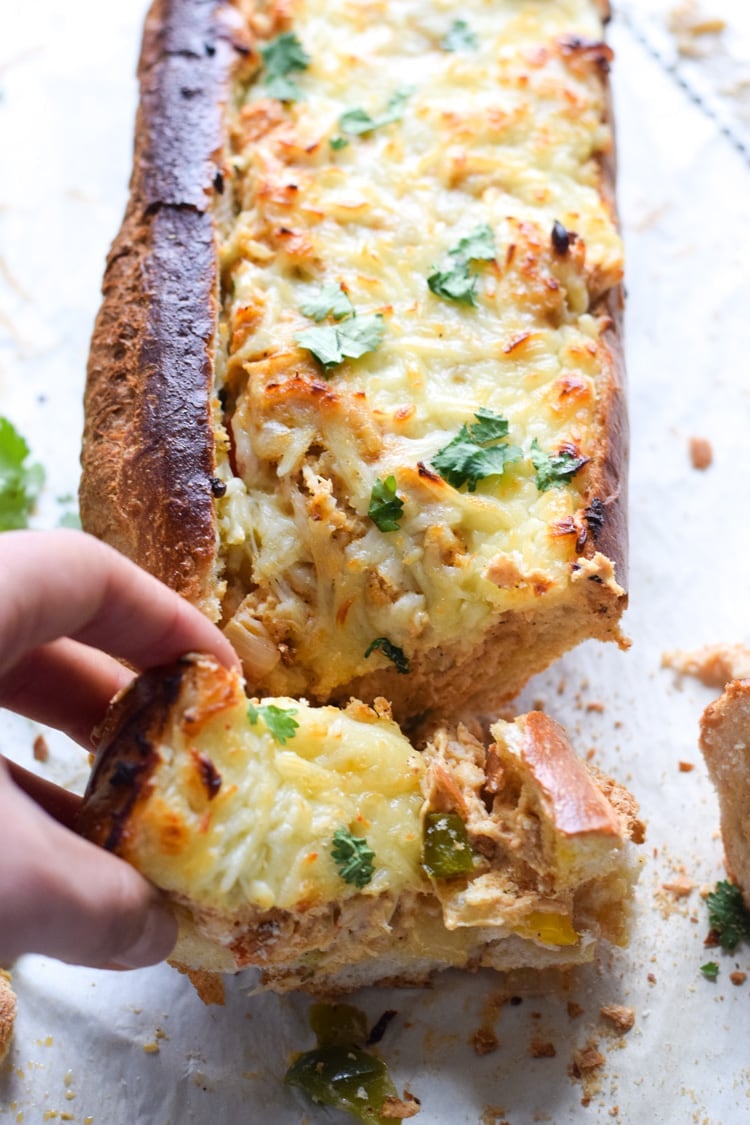 A crowd favorite, this Chicken Fajita Stuffed French Bread is a creamy, cheesy, and super flavorful appetizer that's perfect for parties and game day!
