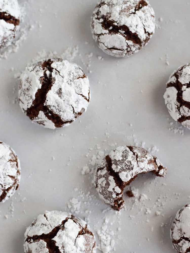 Chocolate crinkle cookies covered in powdered sugar.