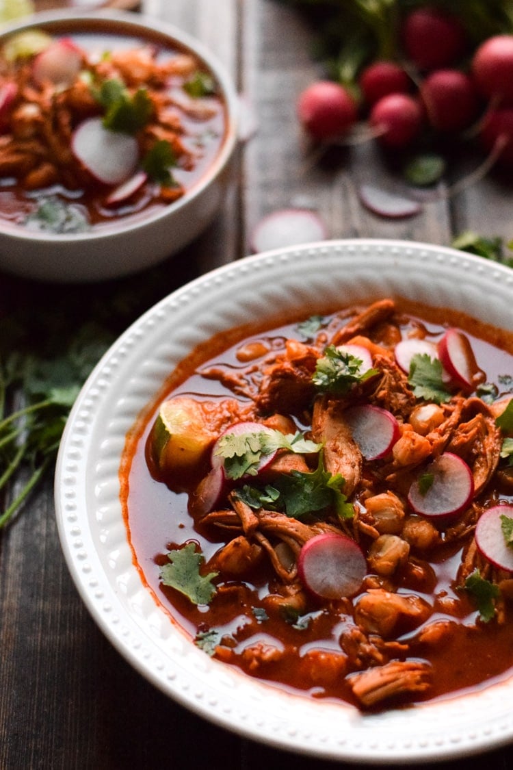 Made with shredded chicken and hominy in a comforting red chile broth, this Mexican Slow Cooker Chicken Posole is easy to make and full of authentic Mexican flavors. (gluten free)