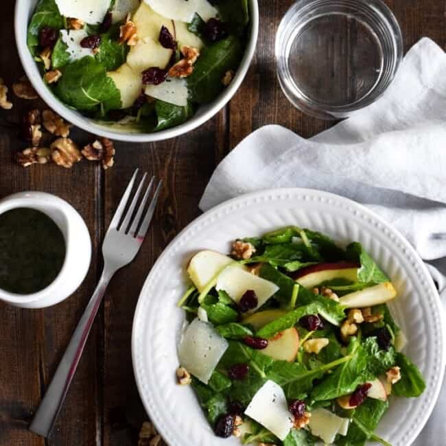 This Apple Pear Salad with a Honey Cilantro Vinaigrette is an easy 5 minute recipe made with crunchy apples, sliced pears, dried cranberries, walnuts and shaved Manchego cheese. (gluten free, low carb, paleo, vegetarian)