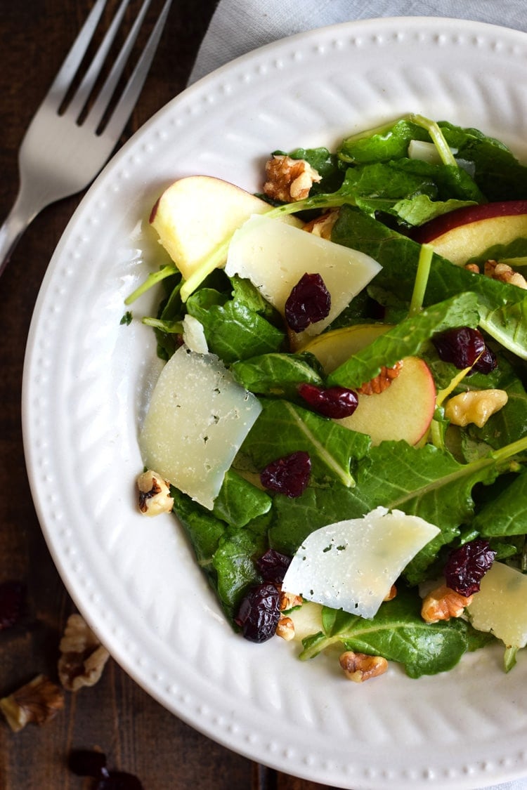 This Apple Pear Salad with a Honey Cilantro Vinaigrette is an easy 5 minute recipe made with crunchy apples, sliced pears, dried cranberries, walnuts and shaved Manchego cheese. (gluten free, low carb, paleo, vegetarian)