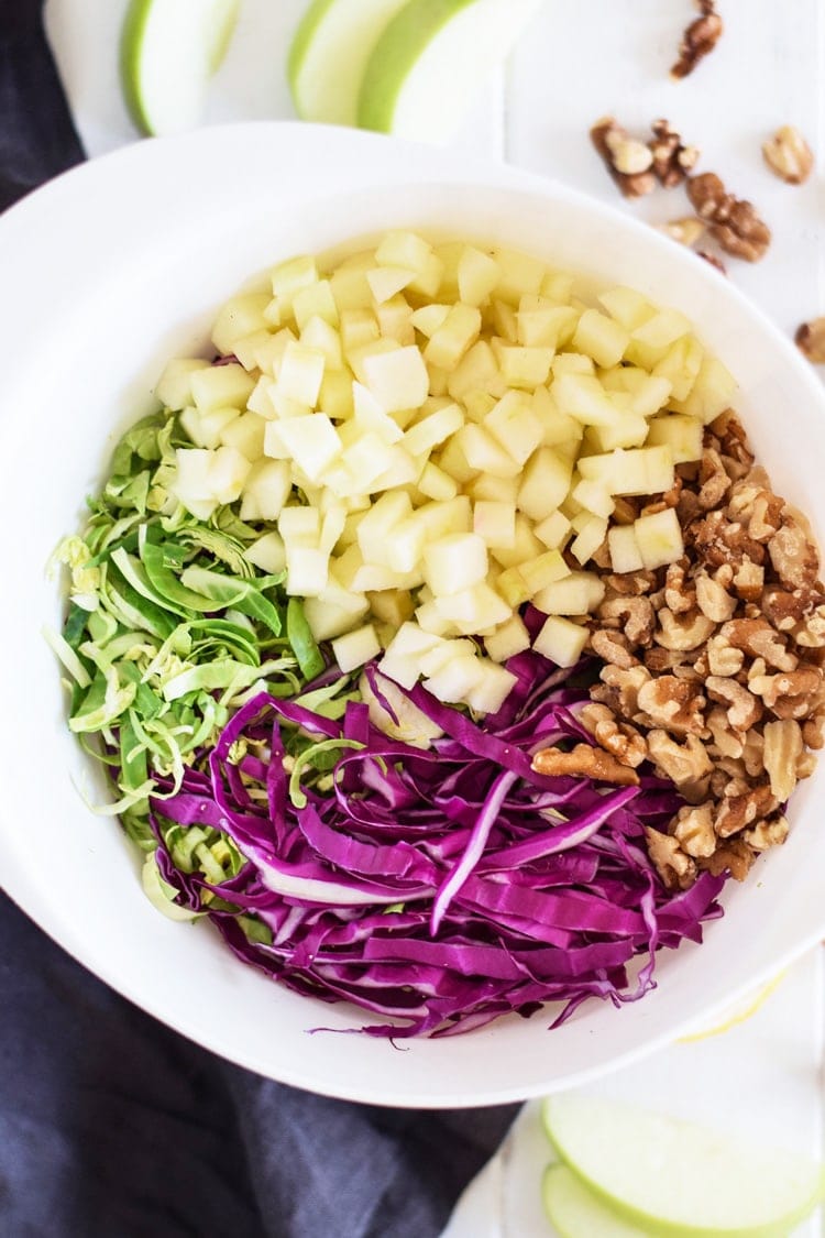 This healthy Brussels Sprouts Slaw with Cabbage and Apples is the perfect side dish for any meal. Also goes great on tacos! (gluten free, paleo, vegetarian, vegan)