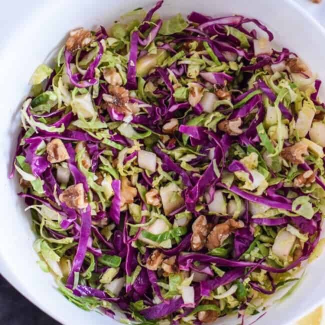 This healthy Brussels Sprouts Slaw with Cabbage and Apples is the perfect side dish for any meal. Also goes great on tacos! (gluten free, paleo, vegetarian, vegan)