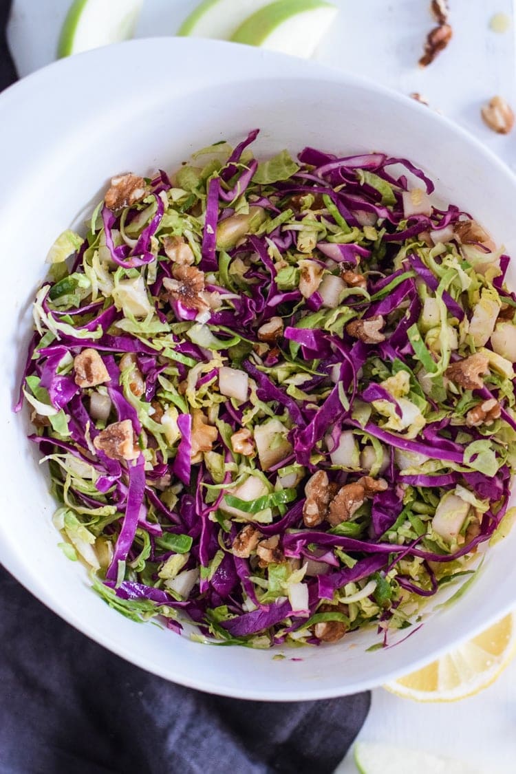 This healthy Brussels Sprouts Slaw with Cabbage and Apples is the perfect side dish for any meal. Also goes great on tacos! (gluten free, paleo, vegetarian, vegan)