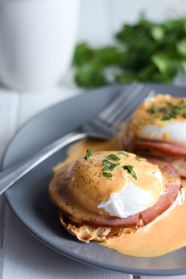 Easy Chipotle Eggs Benedict recipe made with a lightened-up blender chipotle hollandaise sauce. Ready in only 25 minutes and is the perfect brunch!