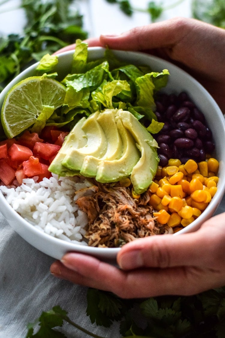 This Healthy Chicken Carnitas Burrito Bowl is easy to make, inexpensive and perfect for meal prep day. Ready in under 20 minutes and is also gluten free.