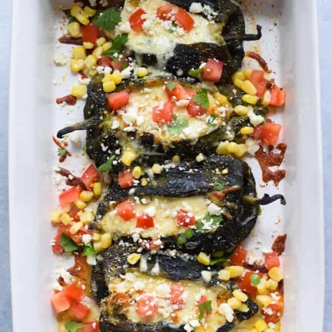 Baked Vegetarian Chile Rellenos - a healthier version of the traditional Mexican dish, these stuffed poblanos are baked and filled with veggies and cheese! (gluten free, low carb)