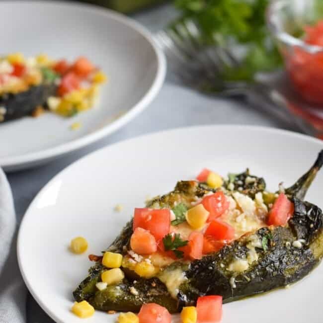 Baked Vegetarian Chile Rellenos - a healthier version of the traditional Mexican dish, these stuffed poblanos are baked and filled with veggies and cheese! (gluten free, low carb)